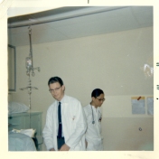 Dr. T. Edward Cuddy with other doctor in ICU, June 1969