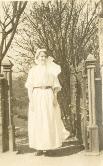 A.D. Allan, RRC [Royal Red Cross?] in gown, Buxton, England, March 18, [1918]