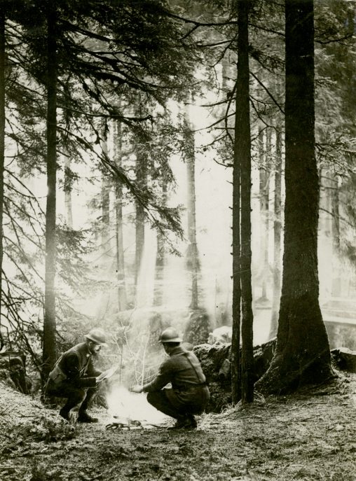 "The surroundings in which the French Armies fought in Alsace. Soldiers at a Camp Fire.""French War Office Official Photograph. Authorised for Publication. Issued by Newspaper Illustrations LTD."- France