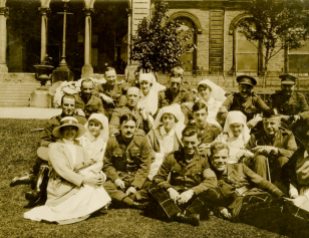 Officer patients and their [nursing] sisters including Miss Owen, masseuse. Buxton, June 1918. England