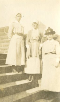 Sisters Hudson, Muirat, Attrill on step #1, Rochester Terrace, Buxton Mar. 1918, England