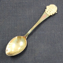 Silver spoon with Winnipeg General Hospital crest on top of handle. Spoon belonged to Ruby Dickie.