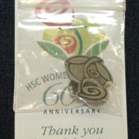 60th anniversary of Women's Hospital promotional pin, 2010. HSC Archives/Museum 2010_33_01